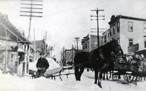 Winter deliveries by horse and wagon on Centre Street