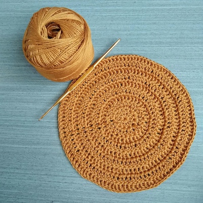 Picture of yellow brown coaster the size 
                for small pots/plates.
