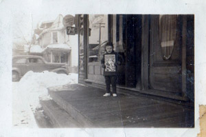 Ed Merrick in front of the store, 1941