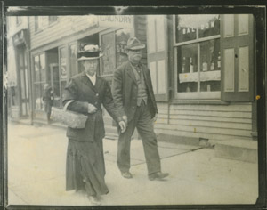 People walking past Charles Lee's laundry