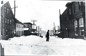 Snow street,
                horse in background