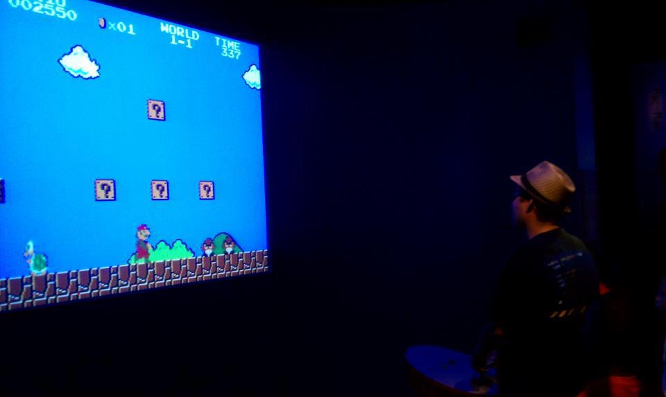 Teaching kids the warp zone trick in Super Mario Bros. at the Smithsonian