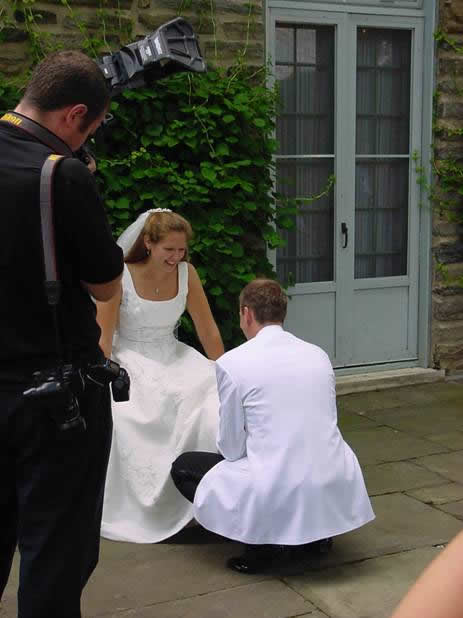 Todd taking off Christines garter.